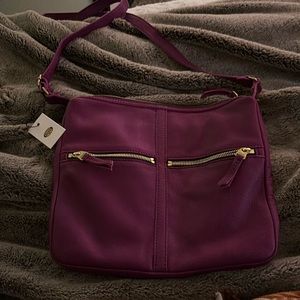 Magenta Fossil crossbody with tags attached